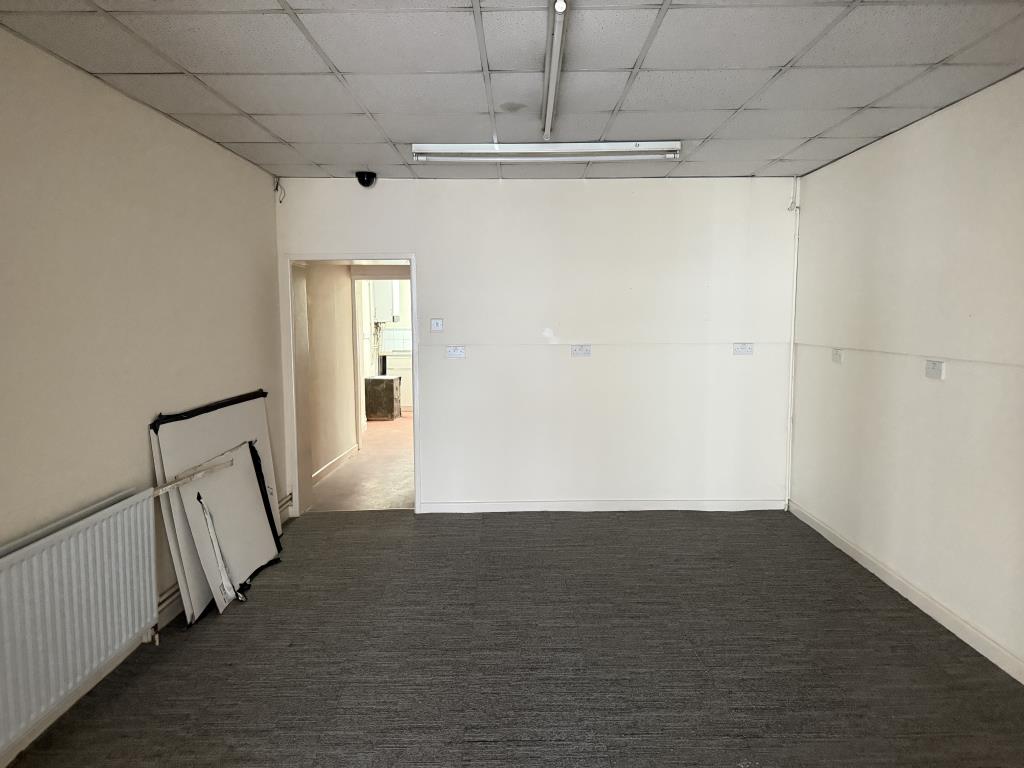 Lot: 49 - FREEHOLD MIXED USE COMMERCIAL RESIDENTIAL - Rear store room of 244 Kingston Road